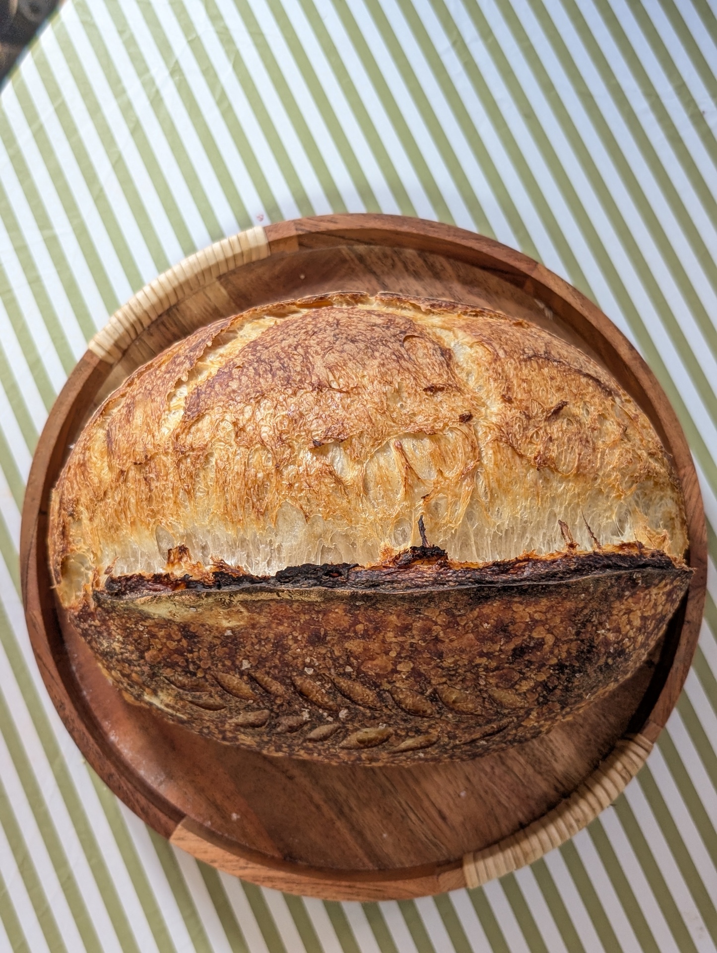 Overhead view of the same sourdough loaf, showing the open crumb inside the ear